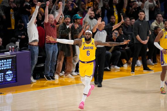 Los Angeles Lakers forward LeBron James celebrates after scoring to pass Kareem Abdul-Jabbar to become the NBA's all-time leading scorer
