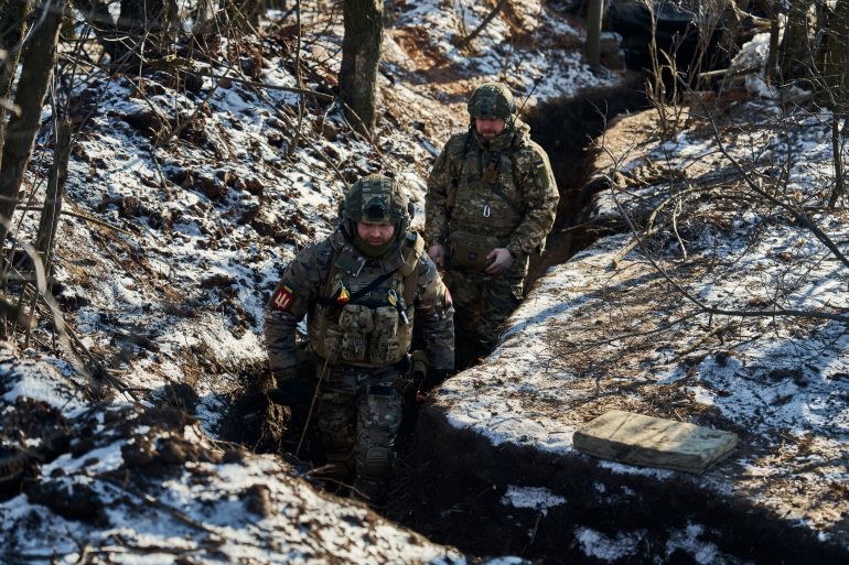 Ukrainian soldiers guard trenches close to the front line near Bakhmut, in Ukraine's eastern Donetsk region on February 8