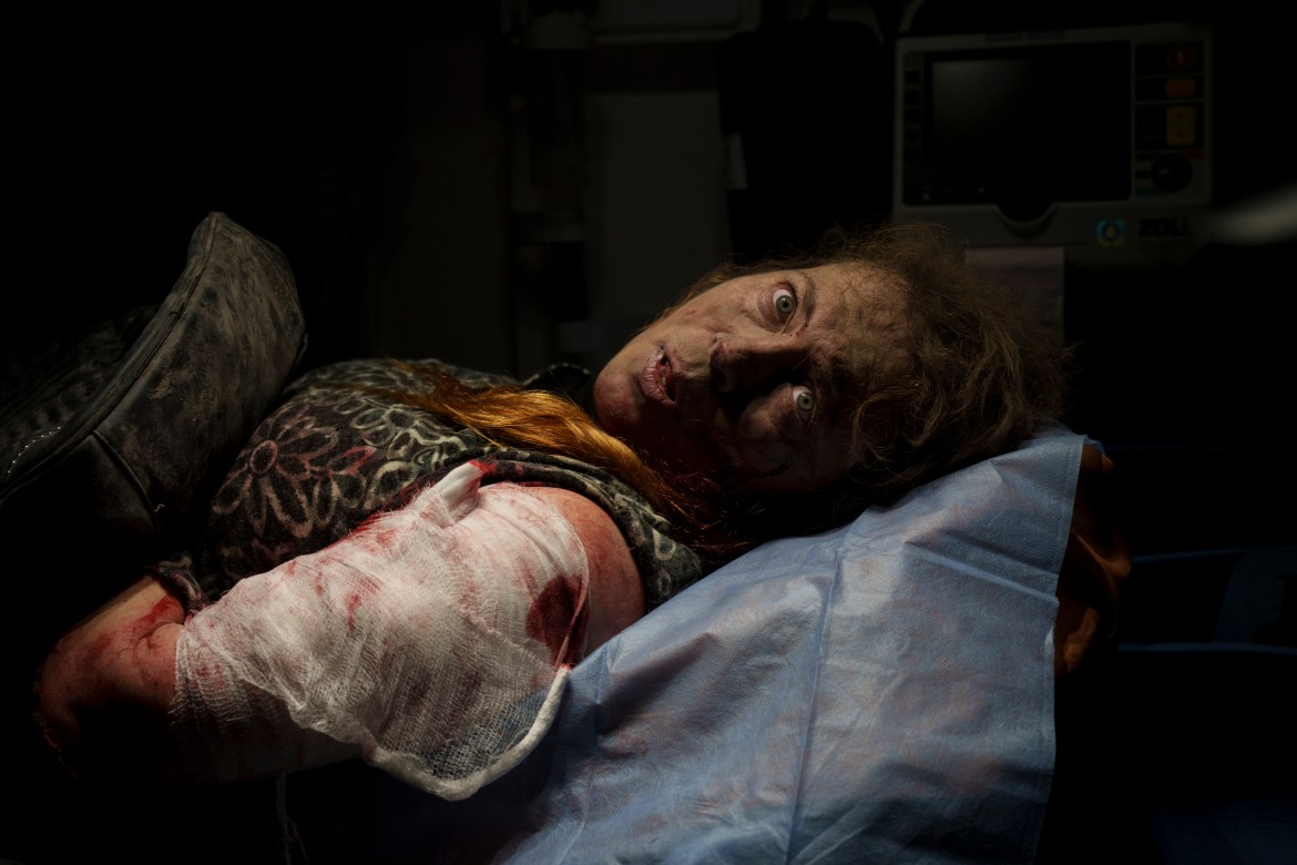 A resident wounded after a Russian attack lies inside an ambulance before being taken to a hospital in Kherson, southern Ukraine