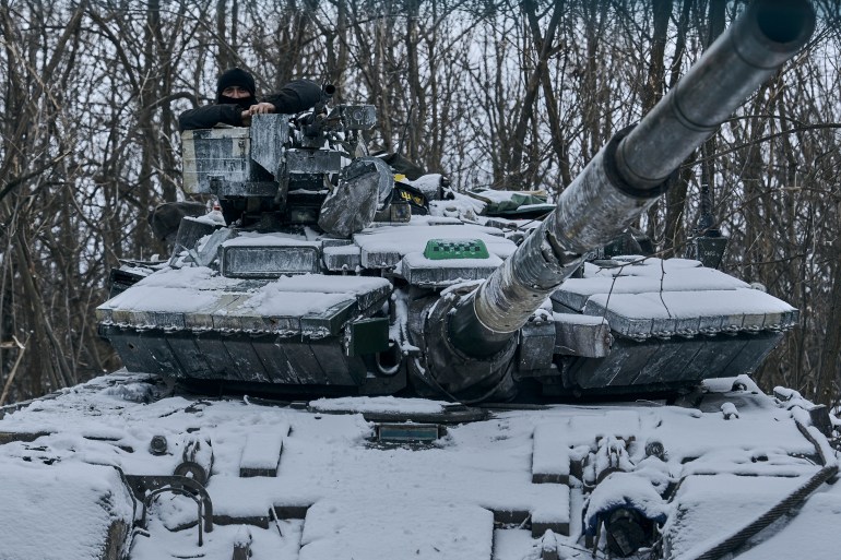 A Ukrainian tank is seen in position in the frontline in Bakhmut, Donetsk region, Ukraine, Sunday, Feb. 12, 2023. (AP Photo/Libkos)