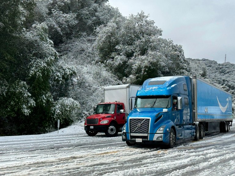 Trucks drive in the snow 