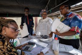 Electoral workers collate results manually at a centre in Lagos, Nigeria.