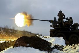 Ukrainian soldiers fire an anti-aircraft gun at a position near Bakhmut in the Donetsk region of Ukraine on Saturday, February 4 [Sergey Shestak/EPA-EFE]
