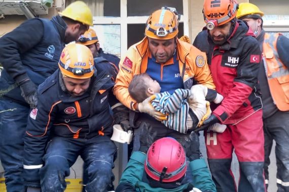 2-year-old Mert Tatar is rescued under rubble after 79 hours of 7.7 and 7.6 magnitude earthquakes hit multiple provinces of Turkiye included Hatay, Turkiye on February 09, 2023. Early Monday morning, a strong 7.7 earthquake, centered in the Pazarcik district, jolted Kahramanmaras and strongly shook several provinces, including Gaziantep, Sanliurfa, Diyarbakir, Adana, Adiyaman, Malatya, Osmaniye, Hatay, and Kilis. Later, at 13.24 p.m. (1024GMT), a 7.6 magnitude quake centered in Kahramanmaras' Elbistan district struck the region. Turkiye declared 7 days of national mourning after deadly earthquakes in southern provinces. (Photo by Erzurum AFAD / Handout/Anadolu Agency via Getty Images)