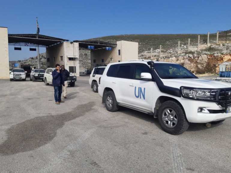 A UN team crossing over into northwest Syria from Turkey at the Bab al-Hawa crossing on Tuesday, February 14, 2023 [Ali Haj Suleiman/Al Jazeera]