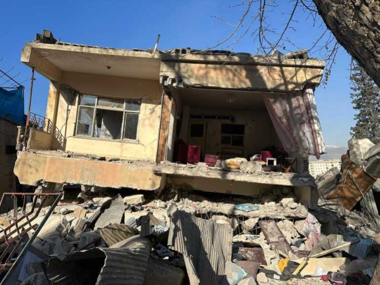 A collapsed building in Kahramanmaras, Turkey, on Tuesday, February 14, 2023 [Stefanie Dekker/Al Jazeera]