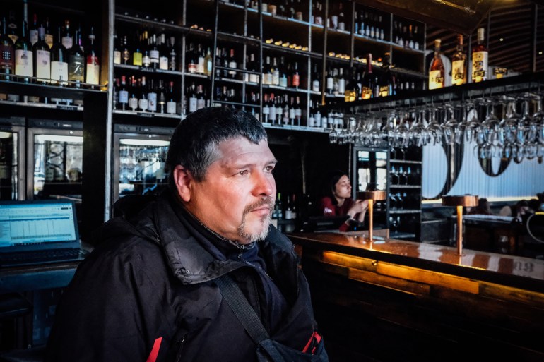 A photo of Maksym Kychma at a wine bar.