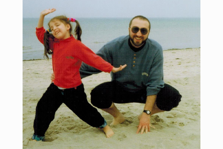 A photo of 8-year old Mariam with her father Levan Pesvianizde on the beach.