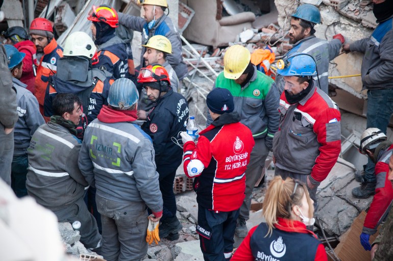 Water and possibly liquid painkillers are being delivered to a young girl who is still alive after being trapped for nearly seven days since the earthquake