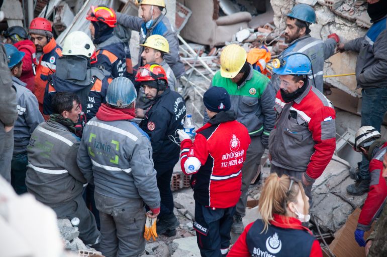Water, and possibly liquid painkillers, are delivered to the young girl who is still alive after being trapped for nearly seven whole days since the earthquake