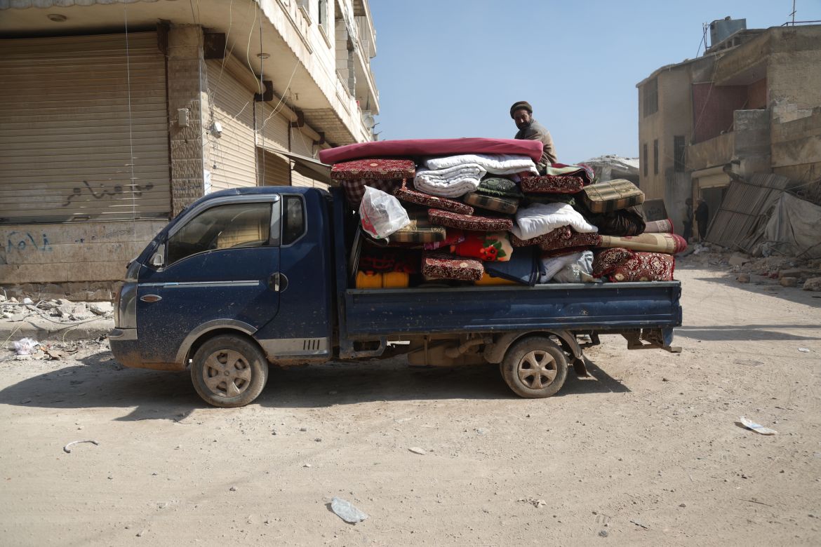 Survivors in Jandaris, Syria, packing up whatever belongings they have left after Monday's earthquake.