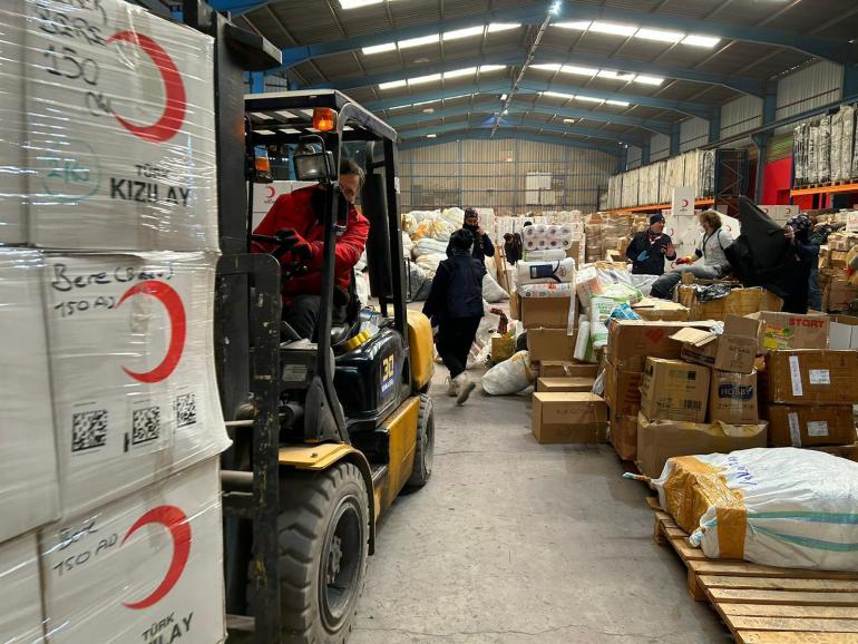 A forklift carrying materials in a Turkish Red Crescent Society aid distribution centre in Hatay province, Turkey.