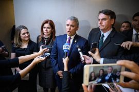 Canadian Foreign Minister Chrystia Freeland, Peru's then-Vice President Mercedes Araoz, Colombia's then-President Ivan Duque and Brazil's then-President Jair Bolsonaro deliver a statement to recognise Venezuelan opposition leader Juan Guaido as that country's interim president, on January 23, 2019, in Davos