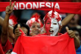 An Indonesian football fan dressed in national colours. Indonesia has lost the right to host the U-20 World Cup tournament [File: Bazuki Muhammad/Reuters]