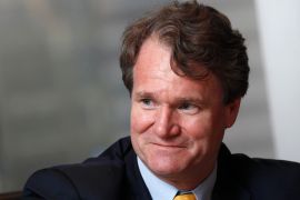 Bank of America Chief Executive Brian Moynihan smiles during an interview.