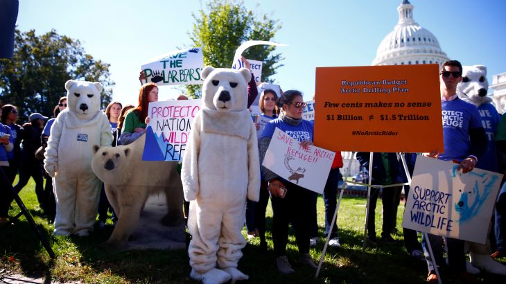 Activists attend a protest against the legislation that would open Wilderness in Alaska to oil drilling on Capitol Hill