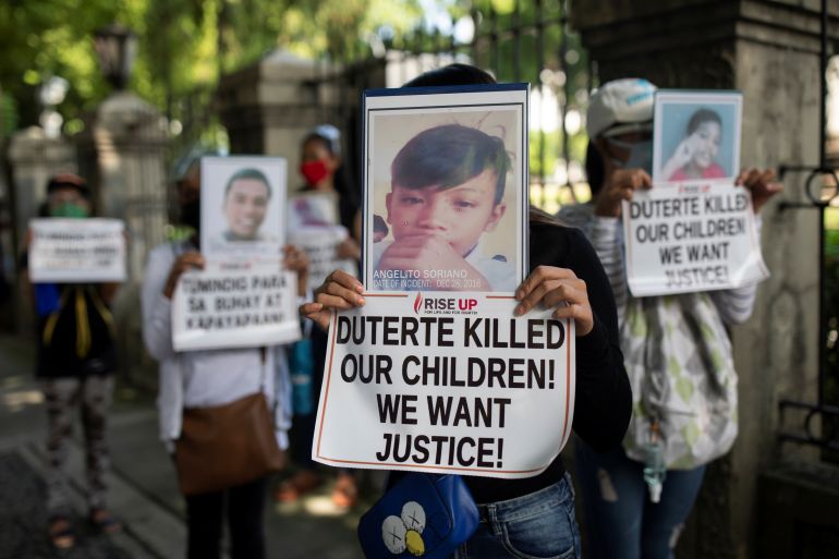 Relatives of drug war victims hold photographs of their slain loved ones with placards calling for justice, during a protest to commemorate President Rodrigo Duterte's final year in office, in Manila, Philippines, June 30, 2021. REUTERS/Eloisa Lopez