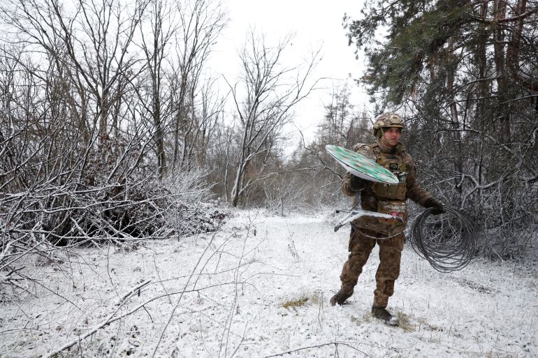“Psycho”, 22 from the 80th Separate Air Assault Brigade disconnects their Starlink on the front line at Orthodox Christmas, during a ceasefire announced by Russia over the Orthodox Christmas period, from the frontline region of Kreminna, Ukraine, January 6, 2023. REUTERS/Clodagh Kilcoyne