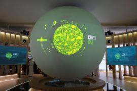 A view shows the COP28 UAE logo on a globe during Abu Dhabi Sustainability Week on January 17, 2023 [File: Reuters/Rula Rouhana]