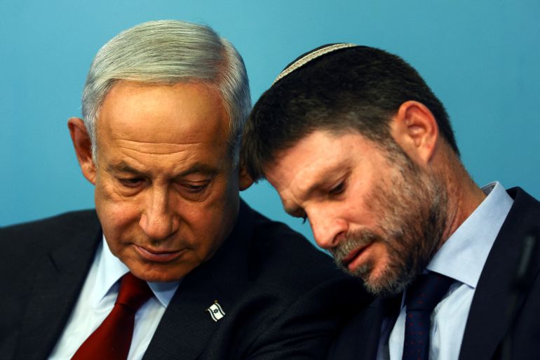 Israeli Prime Minister Benjamin Netanyahu and Israeli Finance Minister Bezalel Smotrich hold a news conference at the Prime Minister's office in Jerusalem, January 25, 2023. REUTERS/Ronen Zvulun/Pool