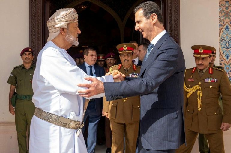 Oman's Sultan Haitham bin Tariq shakes hands with Syrian President Bashar al-Assad during his first trip abroad since the devastating earthquake in Syria
