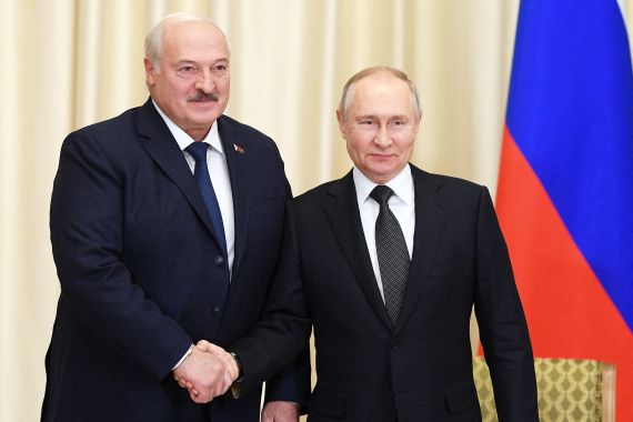 Russian President Vladimir Putin shakes hands with Belarusian President Alexander Lukashenko during a meeting at the Novo-Ogaryovo state residence outside Moscow