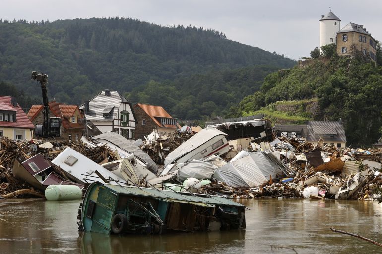 Caravans are destroyed in an area affected by floods caused by heavy rainfalls in Kreuzberg, Germany, July 19, 2021. REUTERS/Wolfgang Rattay/File Photo