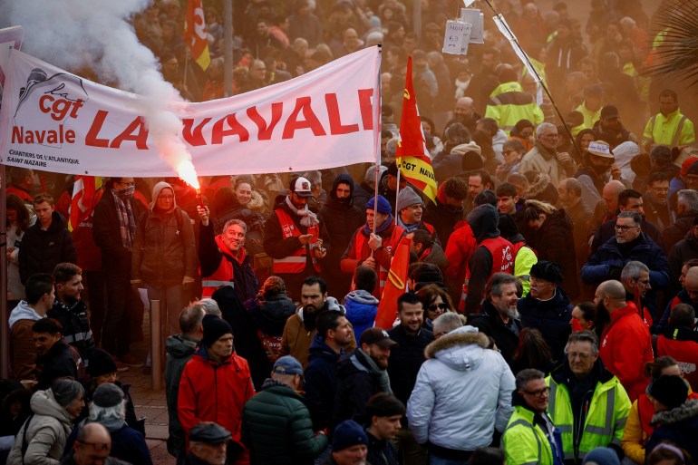 French energy workers of French oil giant TotalEnergies attend a demonstration against French government's pension reform plan in Saint-Nazaire, as part of the sixth day of national strike and protests, in Saint-Nazaire, France