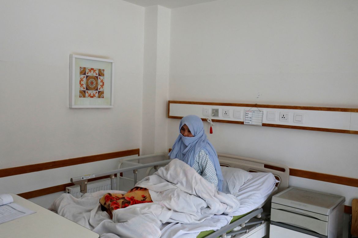 A woman sits on a hospital bed in Bamiyan, Afghanistan