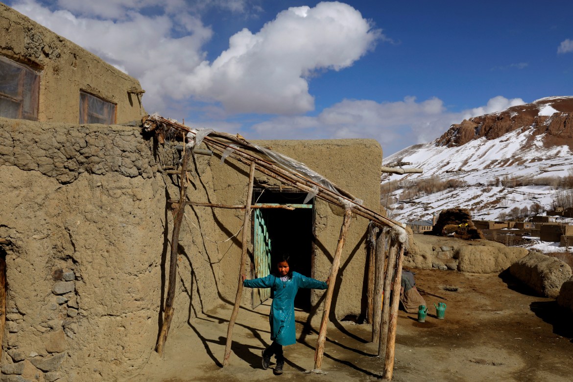 A girl plays outside her house in Foladi Valley, Bamiyan, Afghanistan