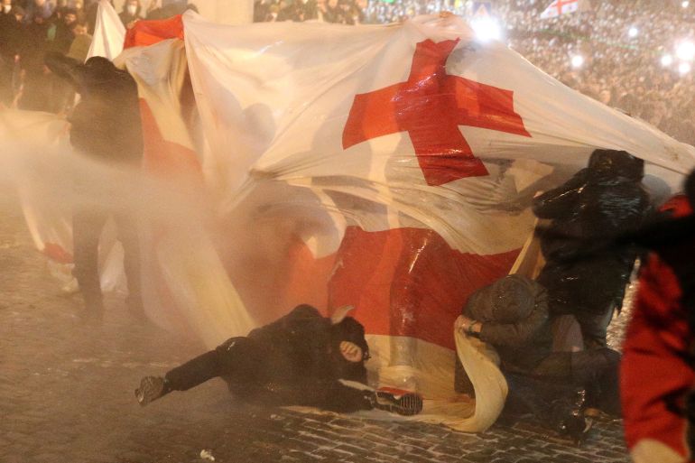 Police use a water cannon to disperse protesters in Tbilisi
