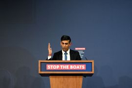 Prime Minister Rishi Sunak speaks during a press conference following the launch of new legislation on refugee and migrant channel crossings at Downing Street on March 7, 2023 in London, United Kingdom. A slogan on the lectern he is speaking from reads 'Stop the boats'.