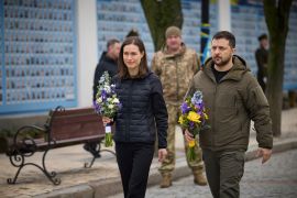 Ukraine's President Volodymyr Zelenskiy and Finnish Prime Minister Sanna Marin visit the Wall of Remembrance to pay tribute to killed Ukrainian soldiers, amid Russia's attack on Ukraine, in Kyiv, Ukraine March 10, 2023. Ukrainian Presidential Press Service/Handout via REUTERS ATTENTION EDITORS - THIS IMAGE HAS BEEN SUPPLIED BY A THIRD PARTY.