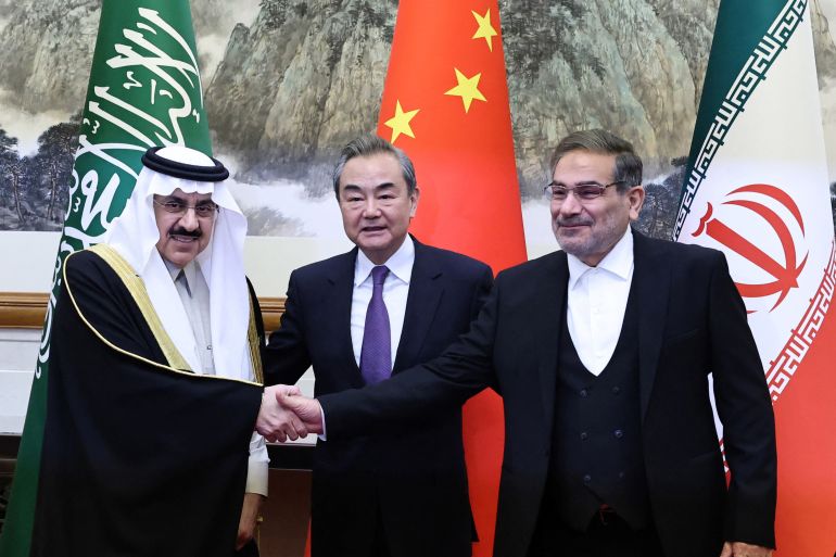 Wang Yi, a member of the Political Bureau of the Communist Party of China (CPC) Central Committee and director of the Office of the Central Foreign Affairs Commission, Ali Shamkhani, the secretary of Iran’s Supreme National Security Council, and Minister of State and national security adviser of Saudi Arabia Musaad bin Mohammed Al Aiban pose for pictures during a meeting in Beijing, China March 10, 2023. China Daily via REUTERS ATTENTION EDITORS - THIS IMAGE WAS PROVIDED BY A THIRD PARTY. CHINA OUT.