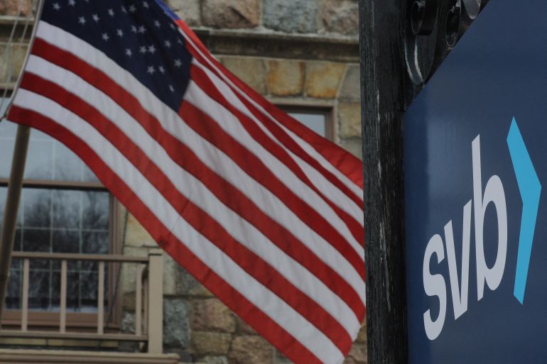 SVB sign in front of a US flag