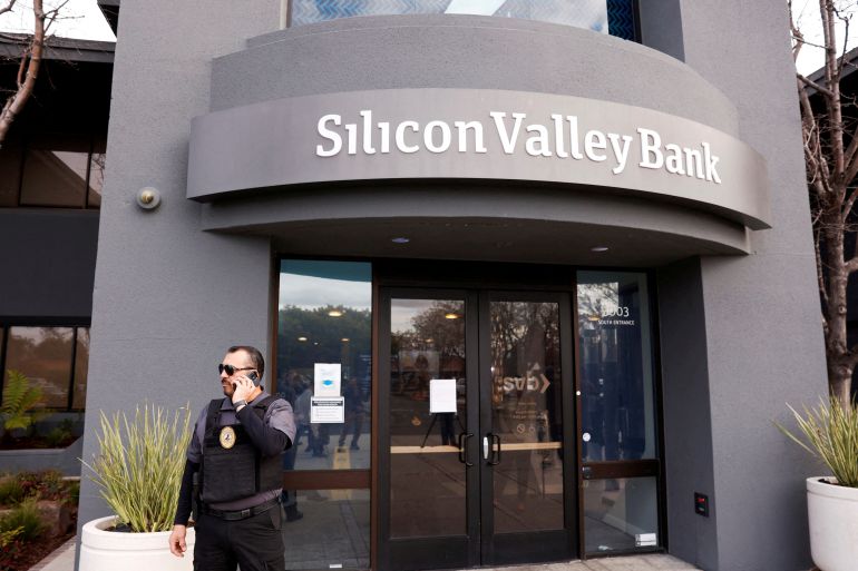 A security guard stands outside the entrance of Silicon Valley Bank headquarters