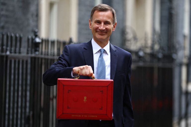 Britain's Chancellor of the Exchequer Jeremy Hunt holds the budget box at Downing Street in London, Britain March 15, 2023. REUTERS/Hannah McKay