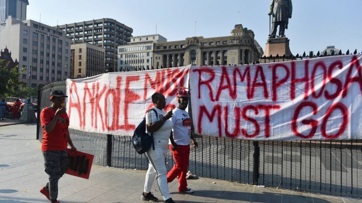 Members of the political party Economic Freedom Fighters (EFF) gather at Church Square after calling for a "National Shutdown" and demanding that President Cyril Ramaphosa resigns in Pretoria, South Africa March 20, 2023.