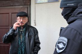 Oleg Orlov, chairman of Russian human rights centre Memorial, smokes while being delivered to Russian Investigative Committee in Moscow, Russia March 21, 2023. REUTERS/Yulia Morozova