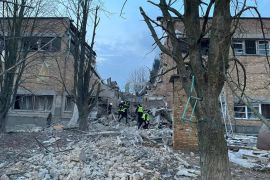Rescuers and police officers work in Kyiv after a drone strike that killed several civilians [Press service of the Kyiv Regional Prosecutor&#39;s Office/Handout via Reuters]