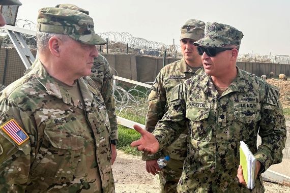FILE PHOTO: U.S. Joint Chiefs Chair Army General Mark Milley speaks with U.S. forces in Syria during an unannounced visit, at a U.S. military base in Northeast Syria, March 4, 2023. REUTERS/Phil Stewart/File Photo