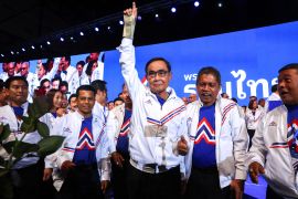 Thai Prime Minister Prayuth Chan-ocha, centre, appears with United Thai Nation Party members during an event in Bangkok on March 25, 2023, to unveil the candidate list and campaign for the May 14 elections [Athit Perawongmetha/Reuters]