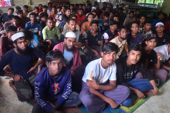 Rohingya refugees sit inside a temporary shelter after they landed in Kuala Matang Peulawi, East Aceh, Aceh province, Indonesia, March 27, 2023, in this photo taken by Antara Foto. Antara Foto/Hayaturrahmah/via REUTERS ATTENTION EDITORS - THIS IMAGE HAS BEEN SUPPLIED BY A THIRD PARTY. MANDATORY CREDIT. INDONESIA OUT. NO COMMERCIAL OR EDITORIAL SALES IN INDONESIA.