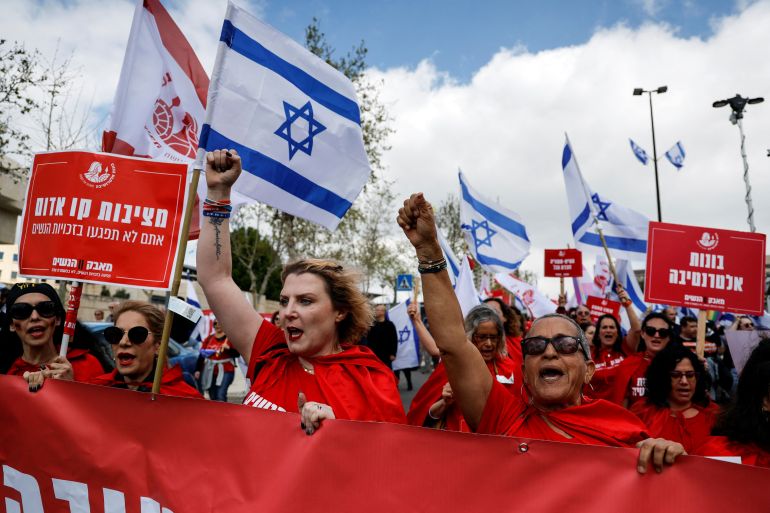 Women dressed as handmaidens from "The Handmaid's Tale" attend a demonstration after Israeli Prime Minister Benjamin Netanyahu dismissed the defense minister and his nationalist coalition government presses on with its judicial overhaul, in Jerusalem, March 27, 2023.