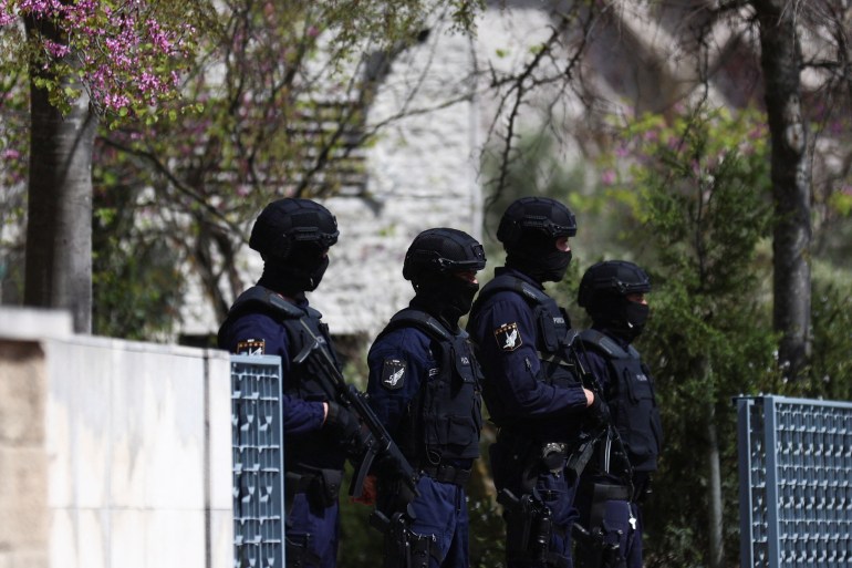 Police officers stand guard outside Ismaili Centre, after a deadly knife attack in Lisbon, Portugal, March 28, 2023. REUTERS/Pedro Nunes