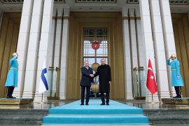 Turkey&#39;s President Recep Tayyip Erdogan and Finland’s President Sauli Niinisto shake hands during a welcoming ceremony in Ankara, Turkey, on March 17 [File: Murat Cetinmuhurdar/Presidential Press Office/Handout via Reuters]