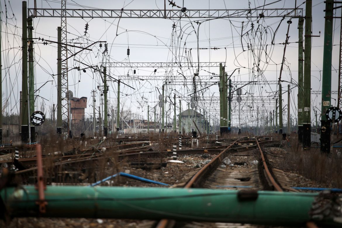 This photograph shows war damaged railroad tracks and power lines in the Sosnove village, Donetsk region