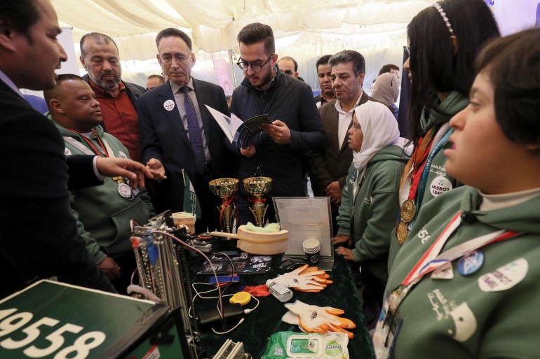 Libyans attend a local robotics competition at school in Tripoli