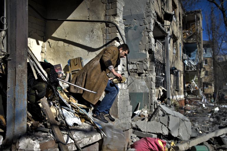 A resident looks for his belongings after a shelling in Kramatorsk, eastern Ukraine.