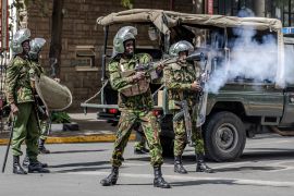 Kenyan Police officer fires teargas to protesters in Nairobi